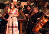 The Lake Washington Symphony Orchestra performs with a woman singing.