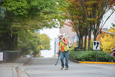 image of street maintenance worker on city street