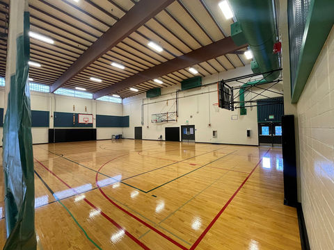 image of inside Tyee Community Gym, with curtain down, view from restroom entrance door