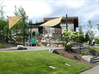 Lewis Creek Park Visitor Center - play area and back of buil